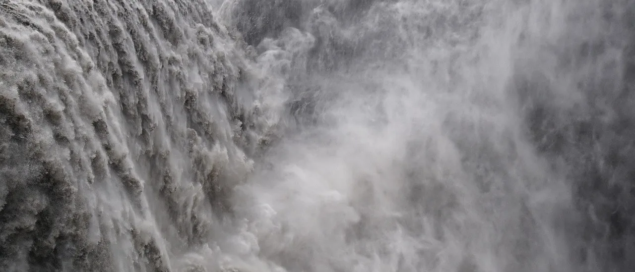 Massive waterfall with intense mist — monochrome